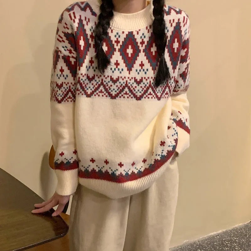 Red and white striped loose retro pullover knitted top with long sleeves on a hanger.