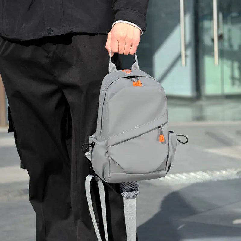 Men's black casual crossbody bag with an adjustable shoulder strap made from waterproof polyester.