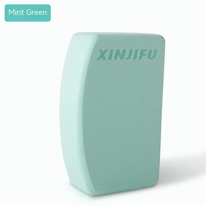 High-density EVA yoga block in mint green colour showing its rectangular shape and flat sides.