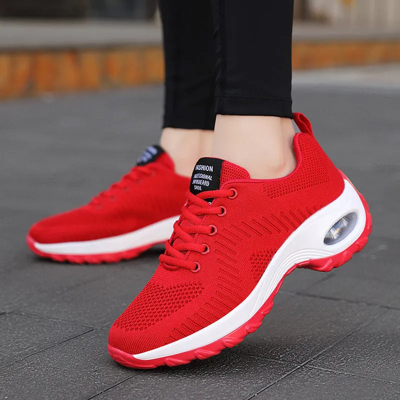 Red women's mesh sneakers with front lace-up and round toe design for casual sports