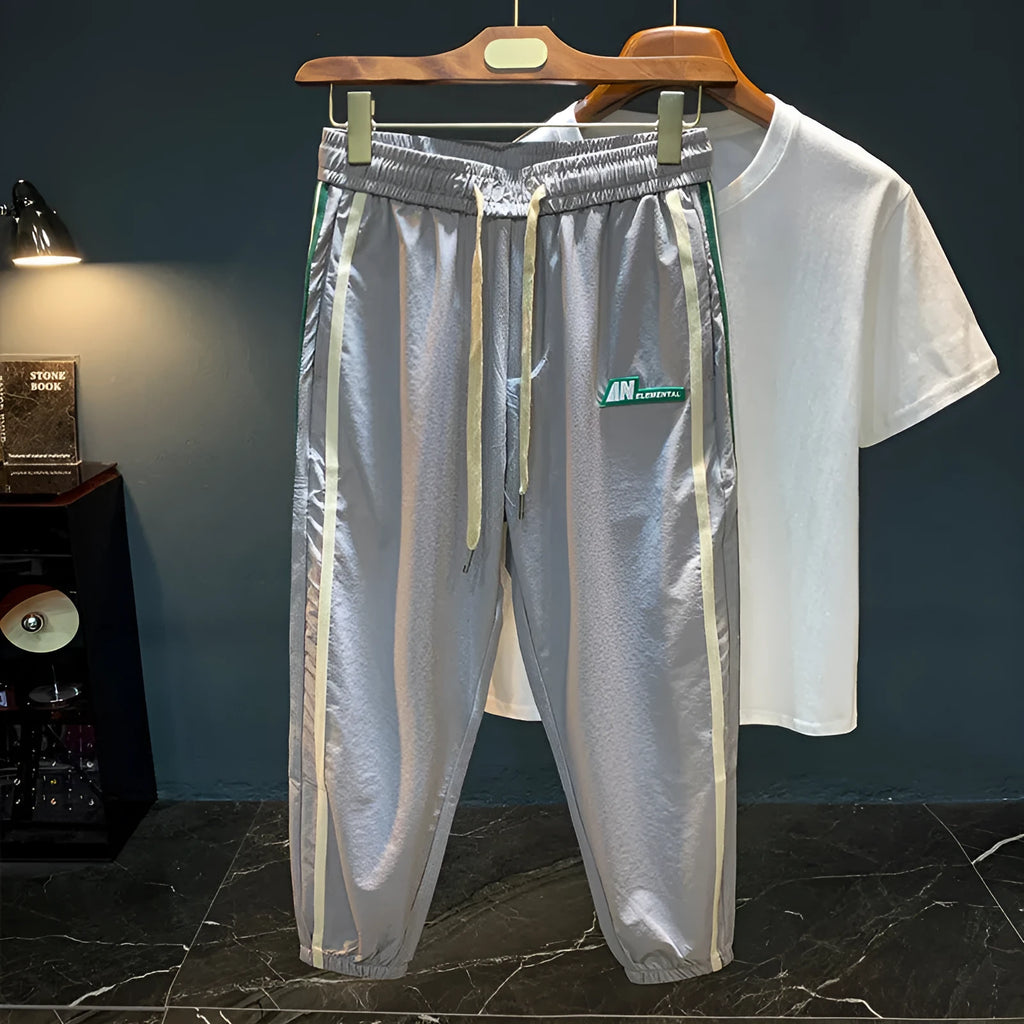 Men's black ice silk harem trousers with mid waist design and relaxed fit
