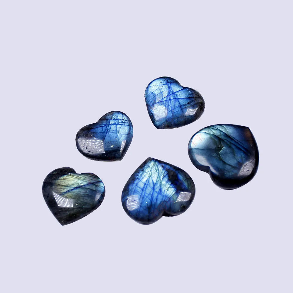 Natural pulled feldspar heart handle pendant in ocean blue moonlight colour on a white background.