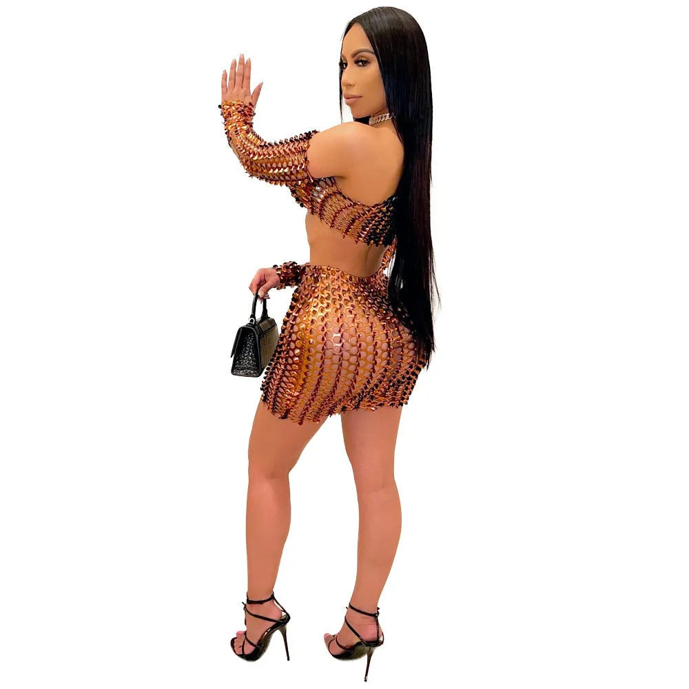Women's sleeveless hollow-out mesh two-piece dress set in black, showing top and short skirt with splicing design.