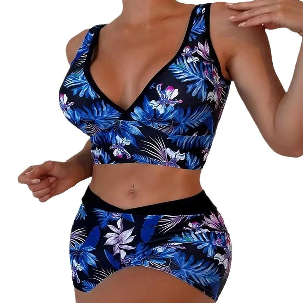 Women's two-piece printed boxer swimsuit set in a colourful style, showing sleeveless top and briefs.