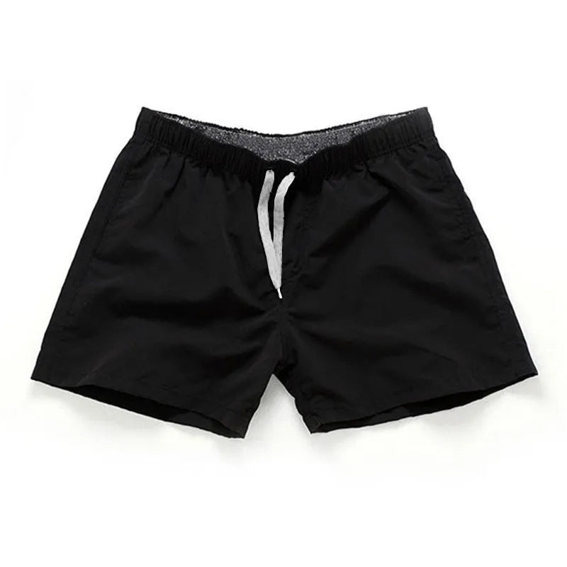 Men's straight leg beach shorts in polyester fabric available in multiple colours and sizes up to 4XL