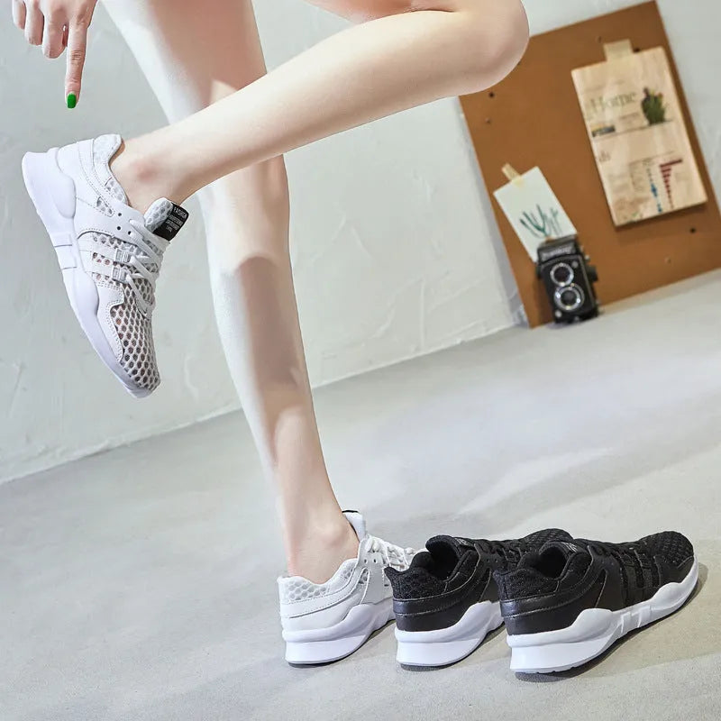Men's black mesh casual sneakers with hollow breathable design and low-top cut