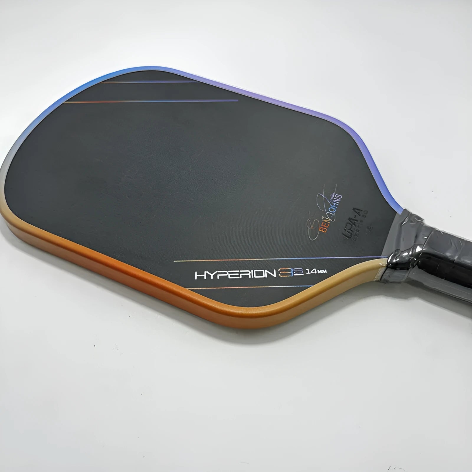 Aurora Hyperion 3s multi-colour matte pickleball racket showing carbon fibre construction.