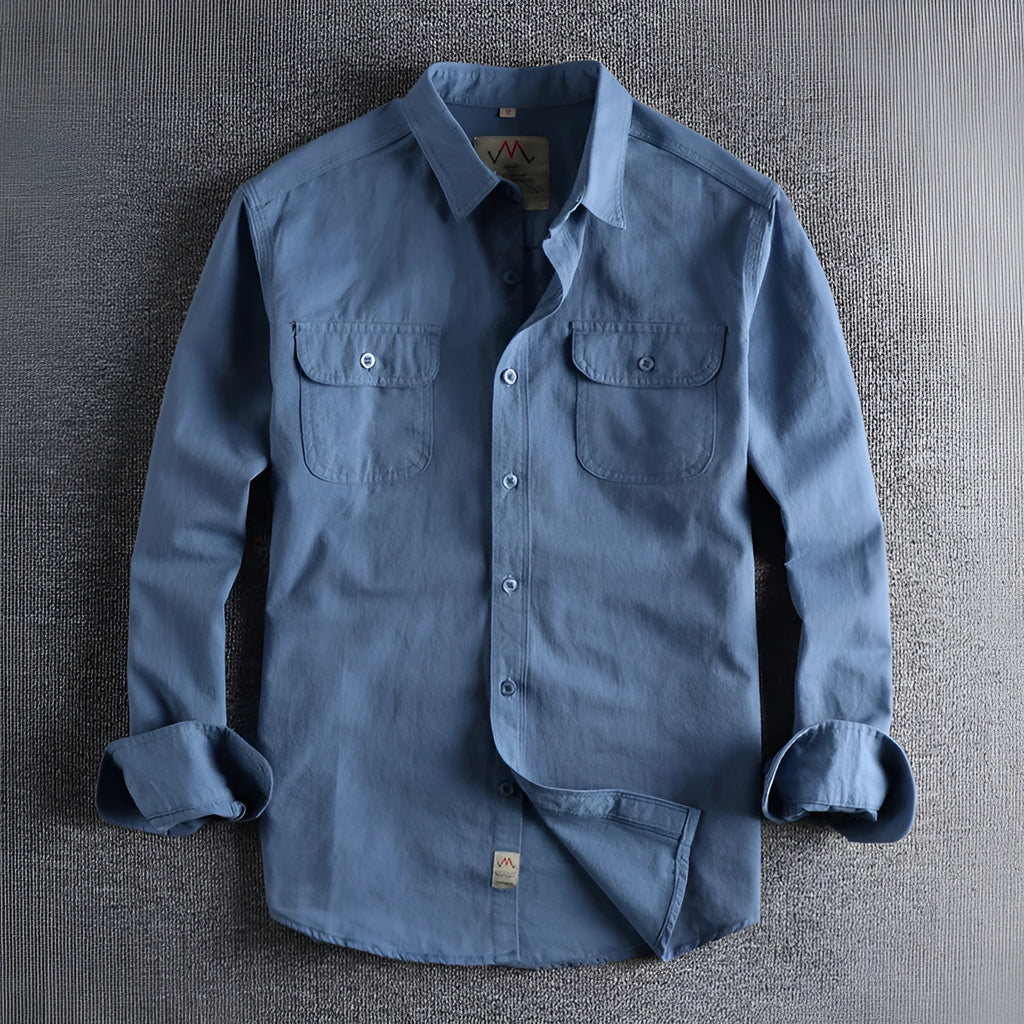 Men's light blue cotton long sleeve shirt in a cardigan style on a hanger.