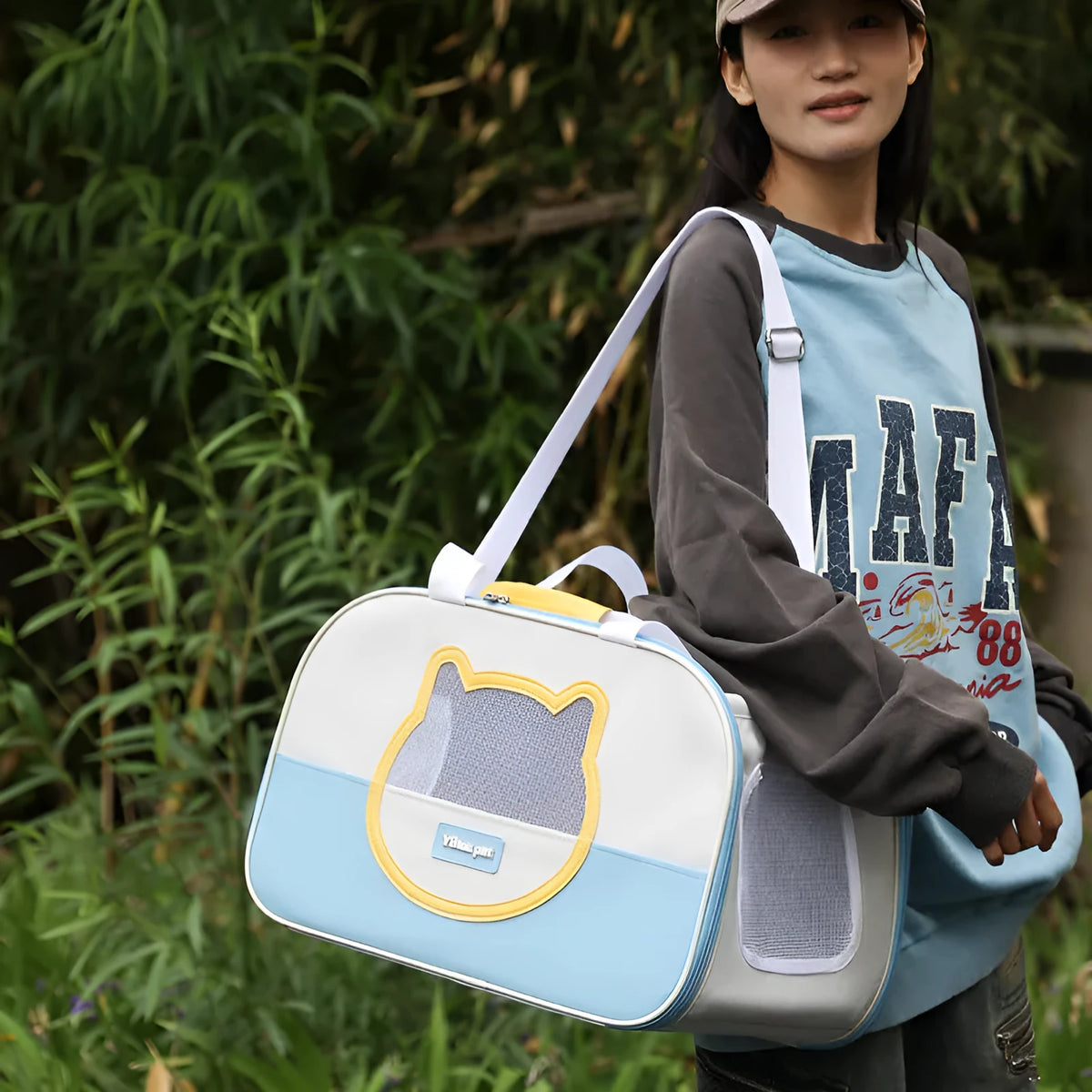 Outdoor foldable cat backpack carrier in blue colour with breathable panels.
