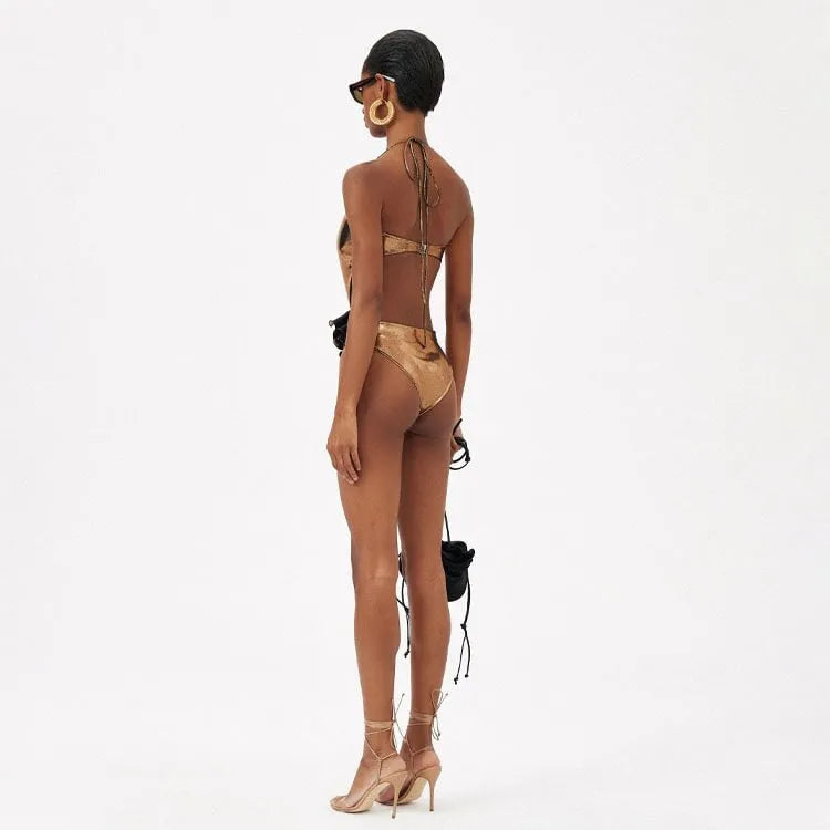 Handmade gold one-piece swimsuit with halter neck and hollow-out design