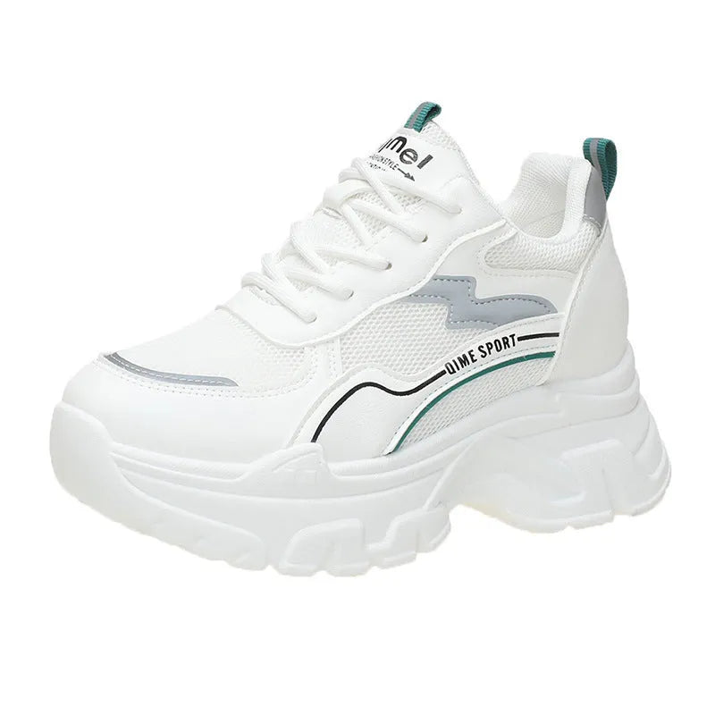 White women's dad shoes with cross shoulder straps and lace-up front on a rubber sole.