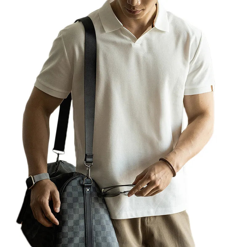Man's American-style blue cotton blend short-sleeved polo shirt on a hanger.