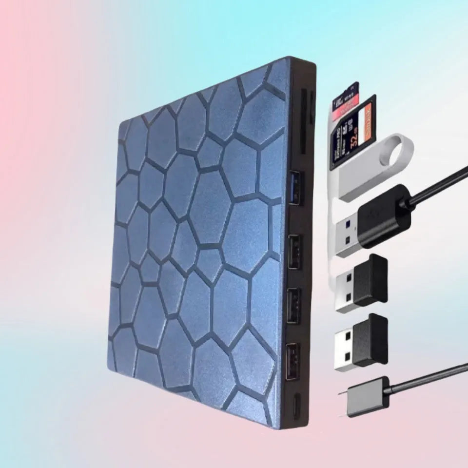 Black external USB CD/DVD drive on a desk next to a laptop