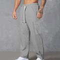 Men's loose-fitting corduroy cargo trousers in a straight wide-leg style with a drawstring waist.