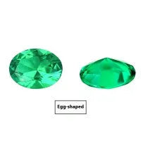 Cultivated emerald loose gemstones in round and fancy cut shapes on a dark background.