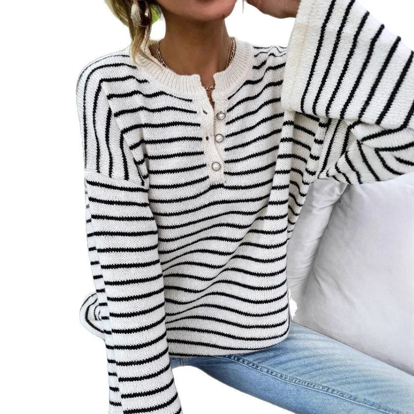Black striped women's casual top with drop shoulders and button detail