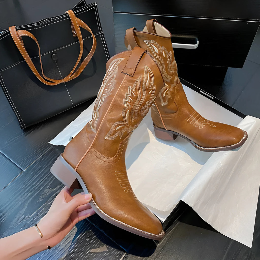 Brown women's embroidered leather Martin boots with a low square heel and mid-calf design.