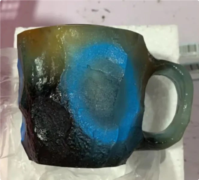 Resin mineral crystal coffee mug with handle in purple colour, showing 3D texture.