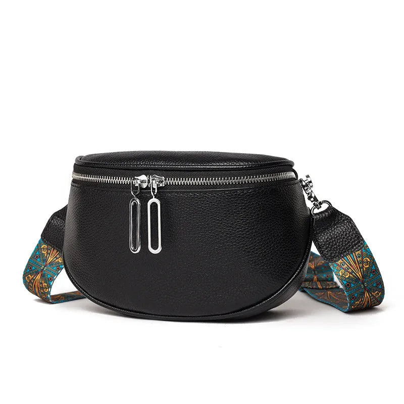 Women's saddle-shaped PU leather messenger bag in black with single shoulder strap and sewing line detailing