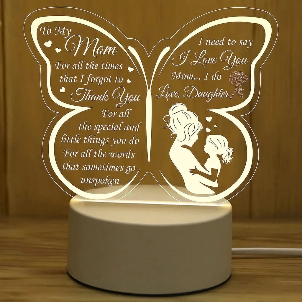 White heart-shaped table lamp with acrylic shade and touch switch on a wooden surface.