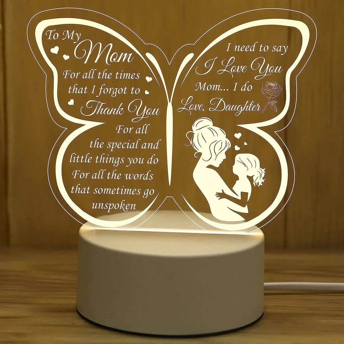 White heart-shaped table lamp with acrylic shade and touch switch on a wooden surface.