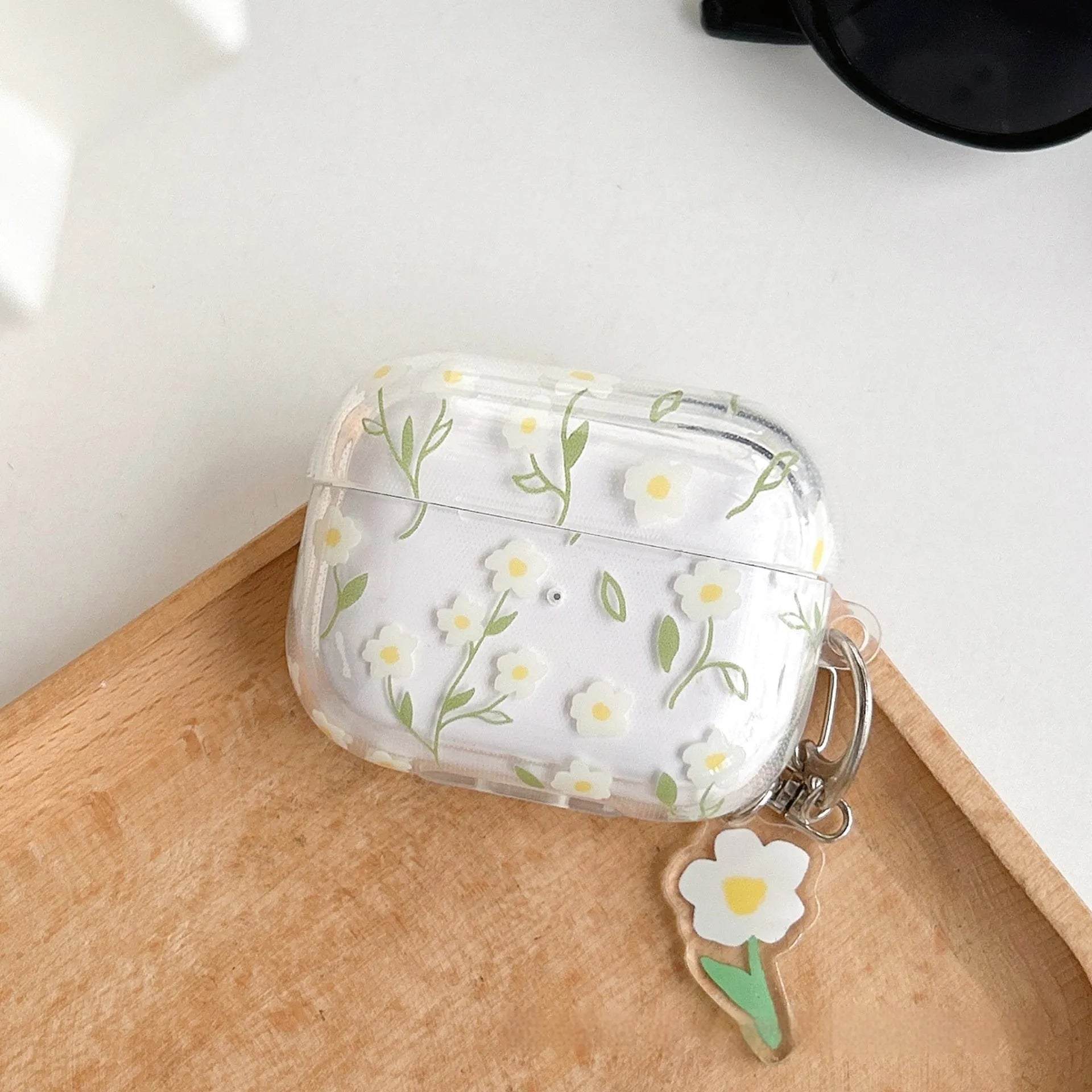 White floral pattern transparent TPU protective case for Apple AirPods showing soft shell design