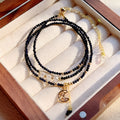 Women's blue and gold three-ring multi-layer bracelet with sand stone beads.