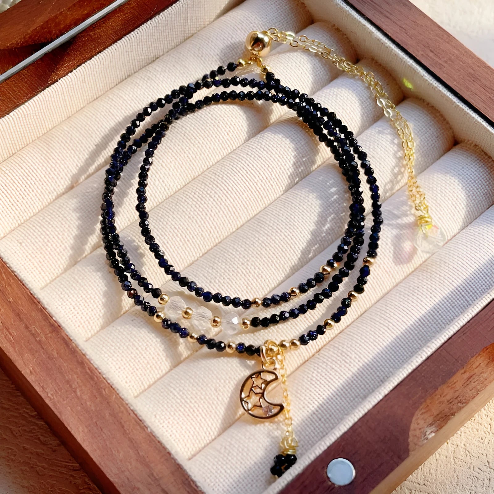 Women's blue and gold three-ring multi-layer bracelet with sand stone beads.