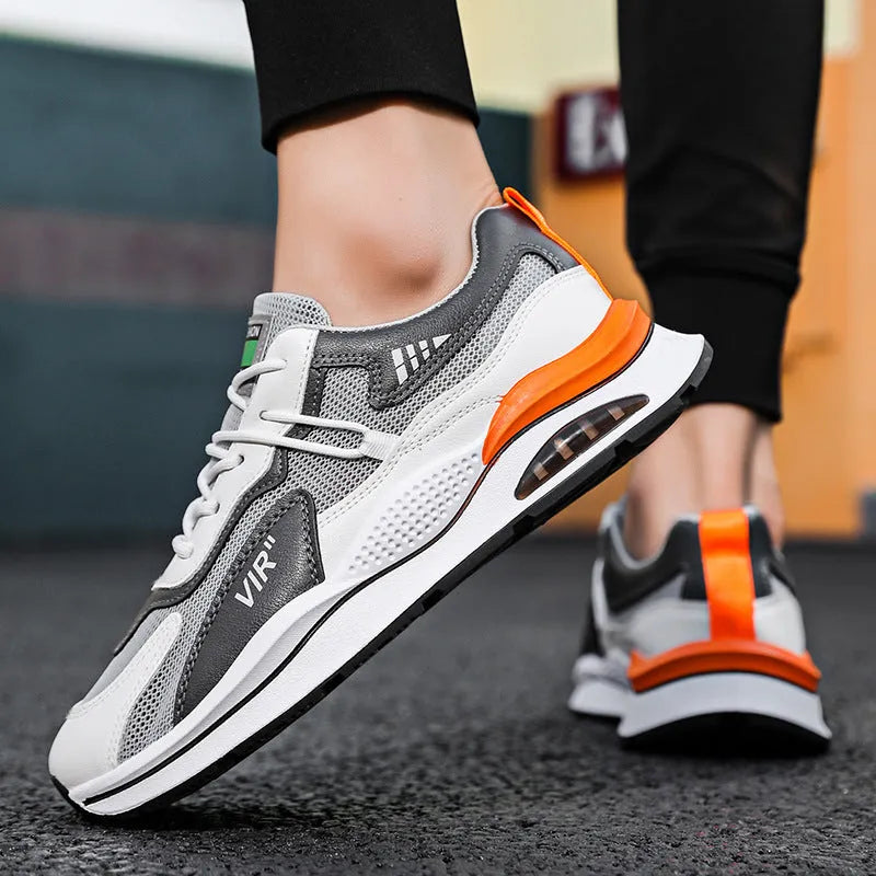 Men's gray mesh running shoes with round toe and middle top height on white background