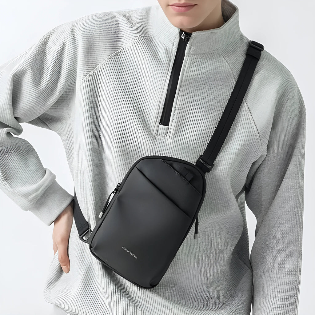 Men's elegant black crossbody bag made from Oxford cloth with visible sewing thread detailing.