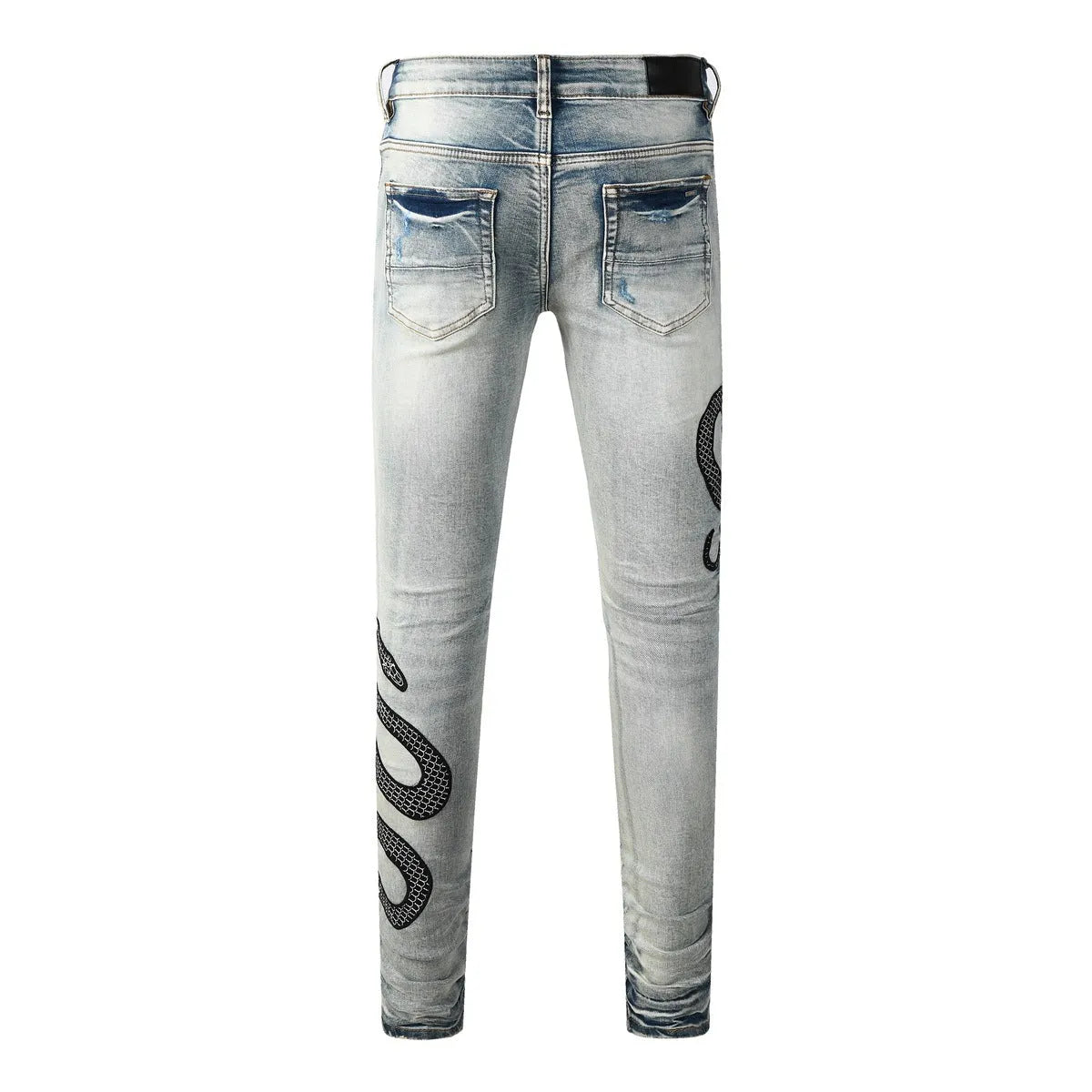 Distressed blue skinny jeans with tapered leg and button fly closure on mid-waist design