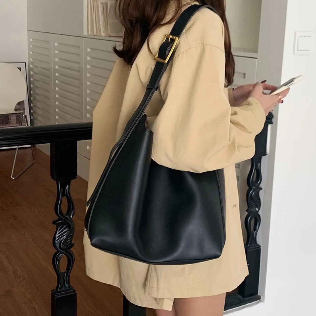 Women's soft PU shoulder bag with swing threads detail in black or brown colour