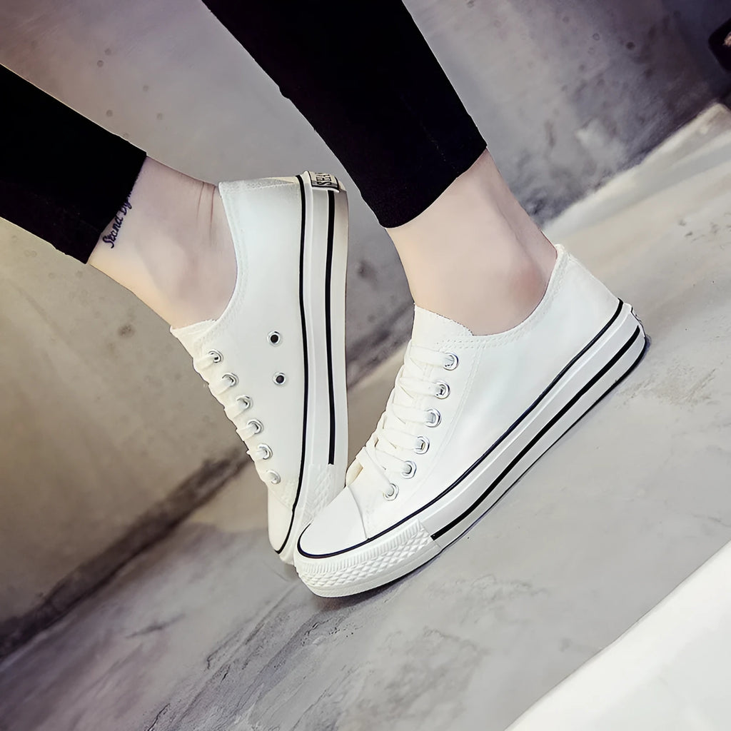 Women's solid colour canvas casual shoes in black, white black, white red, and all black.