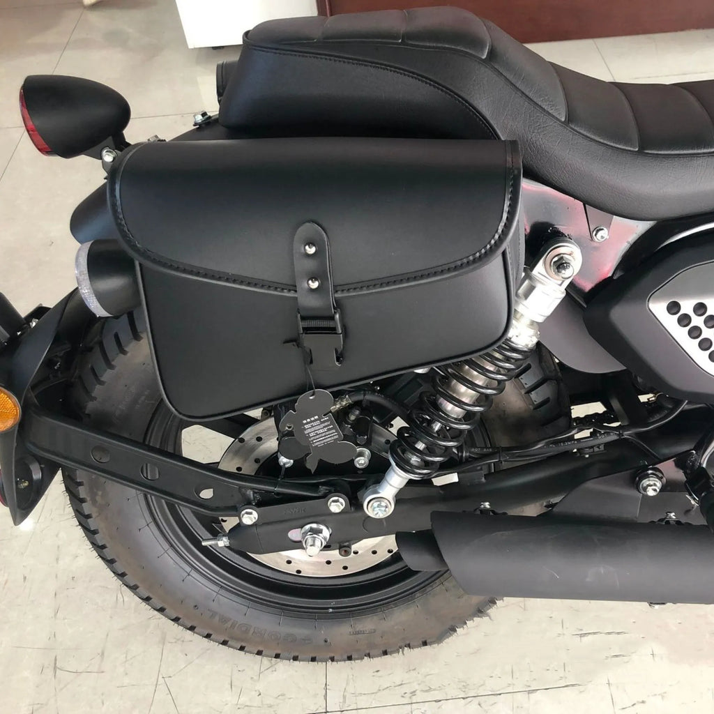 Black PU leather motorcycle swingarm saddlebag mounted on a Harley-Davidson Sportster.