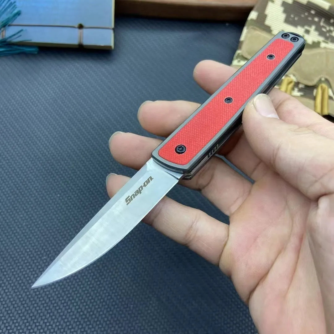 Folding fruit knife with stainless steel blade in black, brown, or red colour options