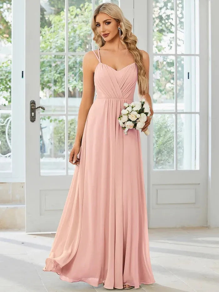 Women's light green sleeveless sling dress with pleated long A-line skirt