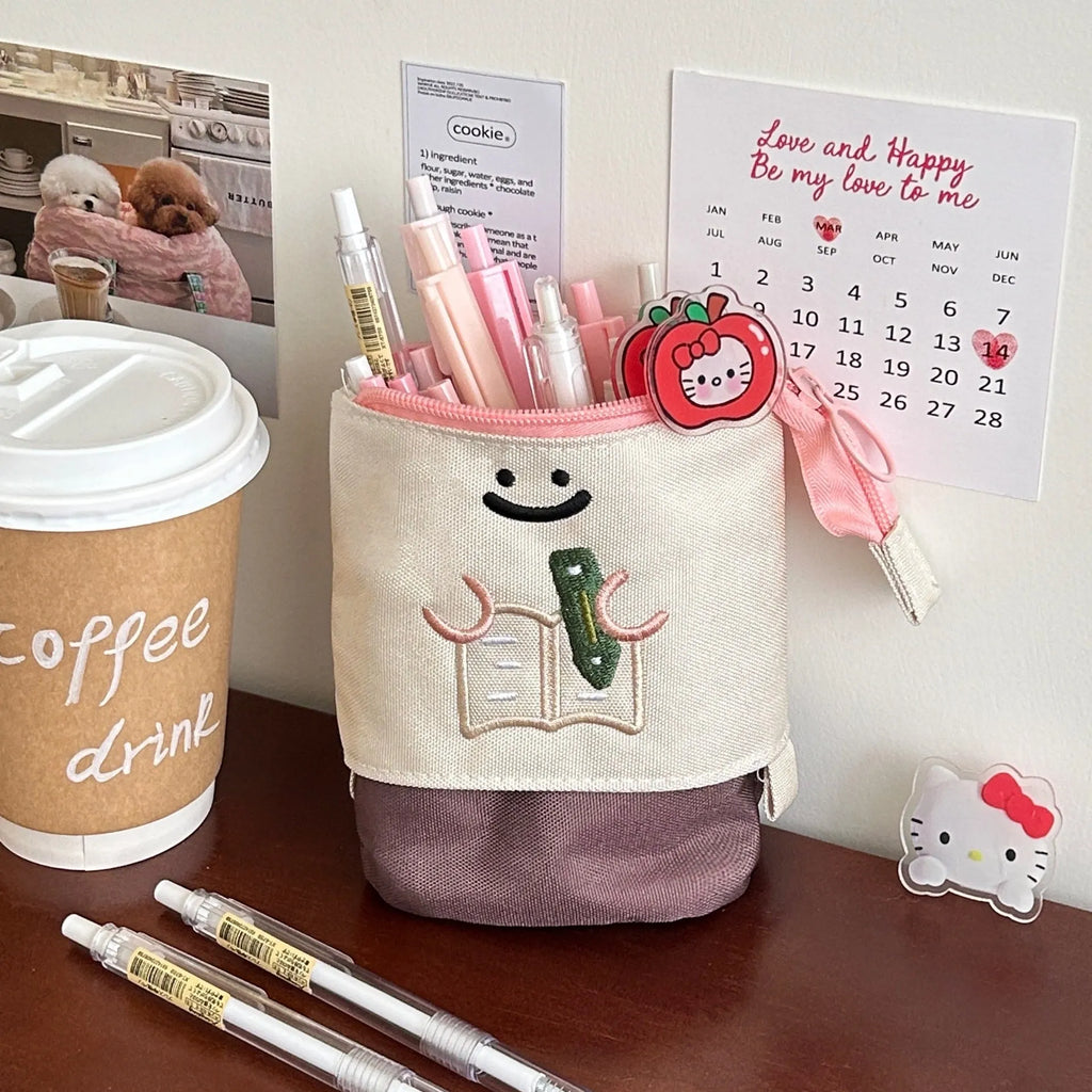 Brown Korean-style collapsible pencil case with Oxford fabric construction showing 17cm by 14cm dimensions