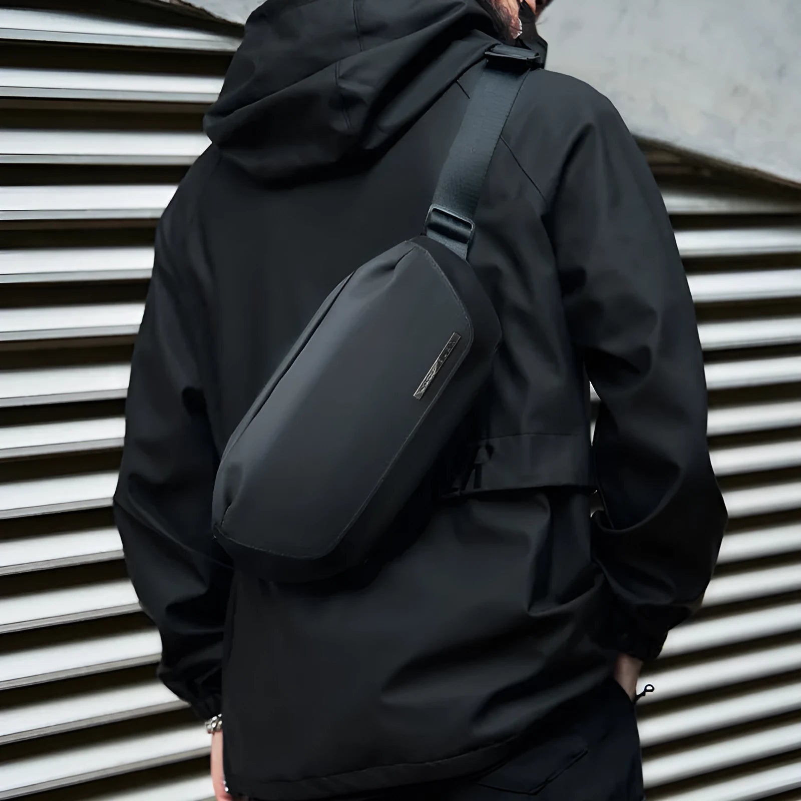 Black men's messenger bag made from Oxford cloth with one-shoulder cross-body design