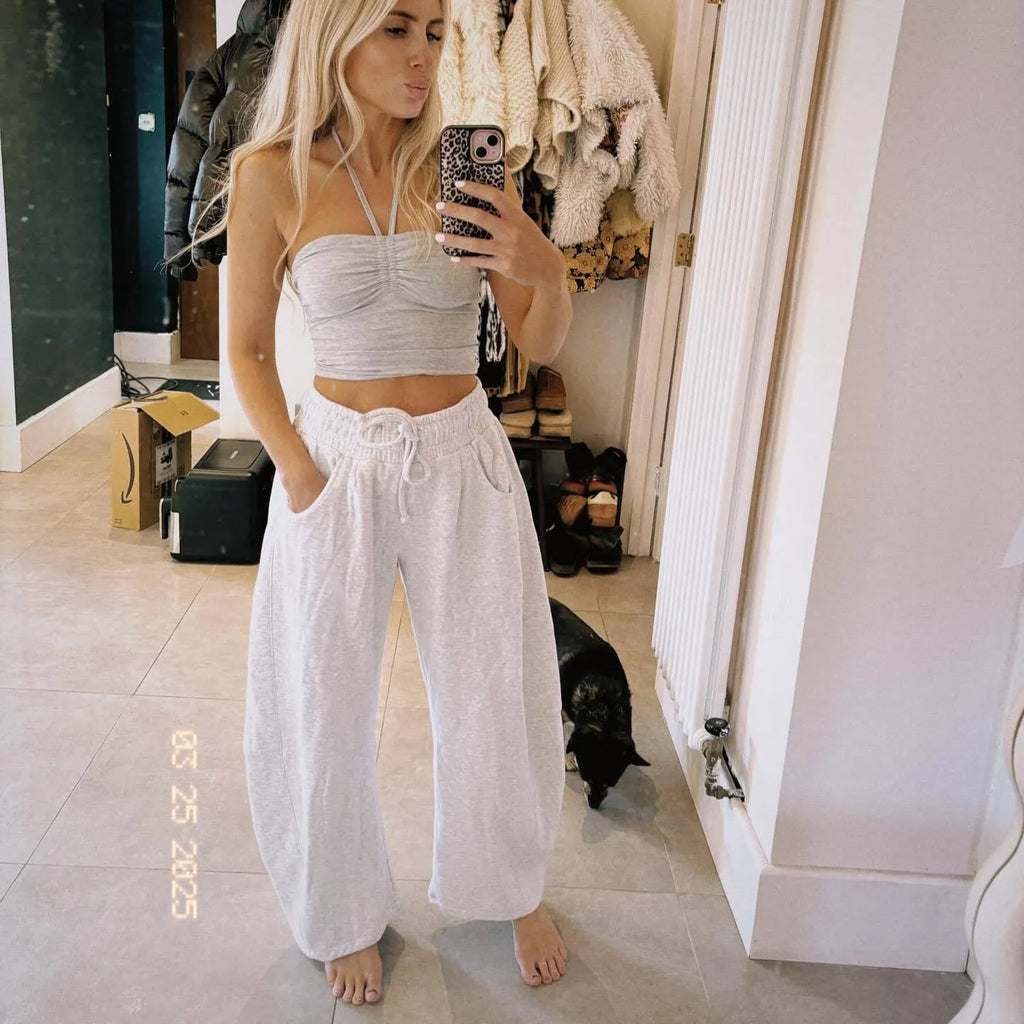 Loose cotton cropped sweatpants with drawstring waist in apricot colour showing street fashion styling