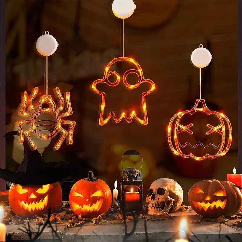 Halloween battery-powered LED window lights with suction cups showing spider, pumpkin and ghost designs