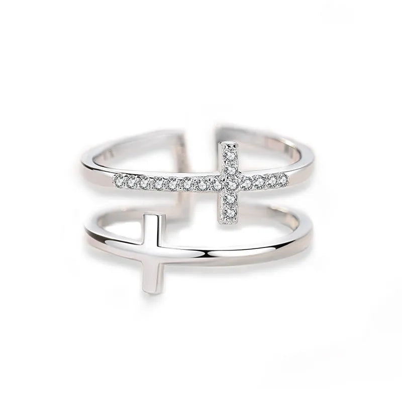 Women's double cross geometric open ring with zircon inlay on copper, showing adjustable opening.