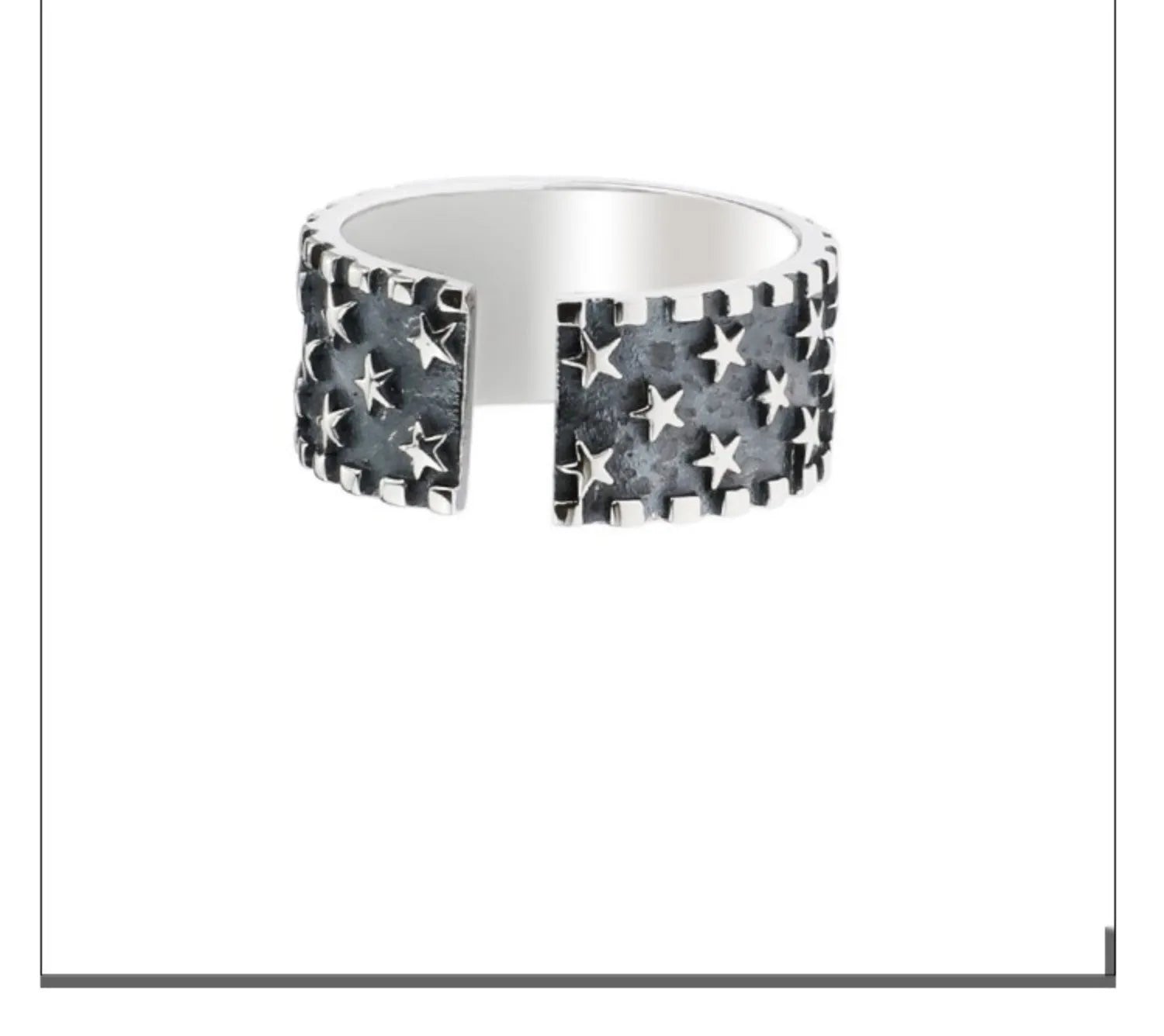 Adjustable sterling silver ring with a geometric pattern of five pointed stars on the band.