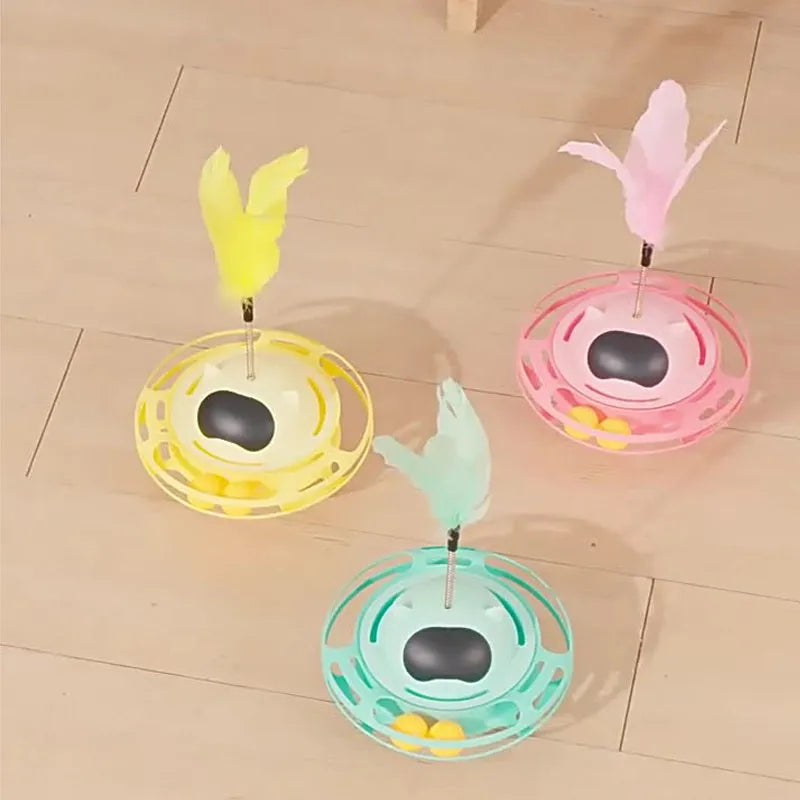 Pink cat tumble turntable toy with attached cat stick for interactive play