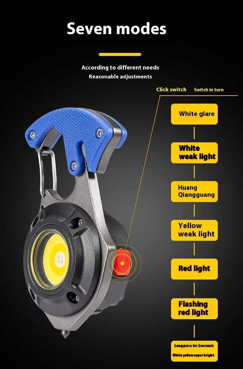 Silver and black multifunctional keychain light with LED array, window breaking hammer tip, and screwdriver.