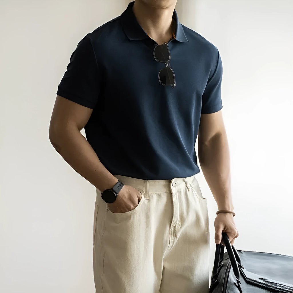 Man's American-style blue cotton blend short-sleeved polo shirt on a hanger.
