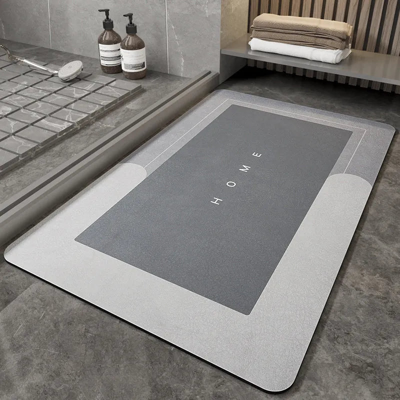 Blue oval blended fabric bathroom floor mat placed on tiled floor.