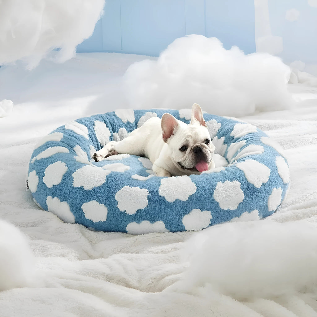 Round plaid dog bed with a plastic base in sea blue and white colour.