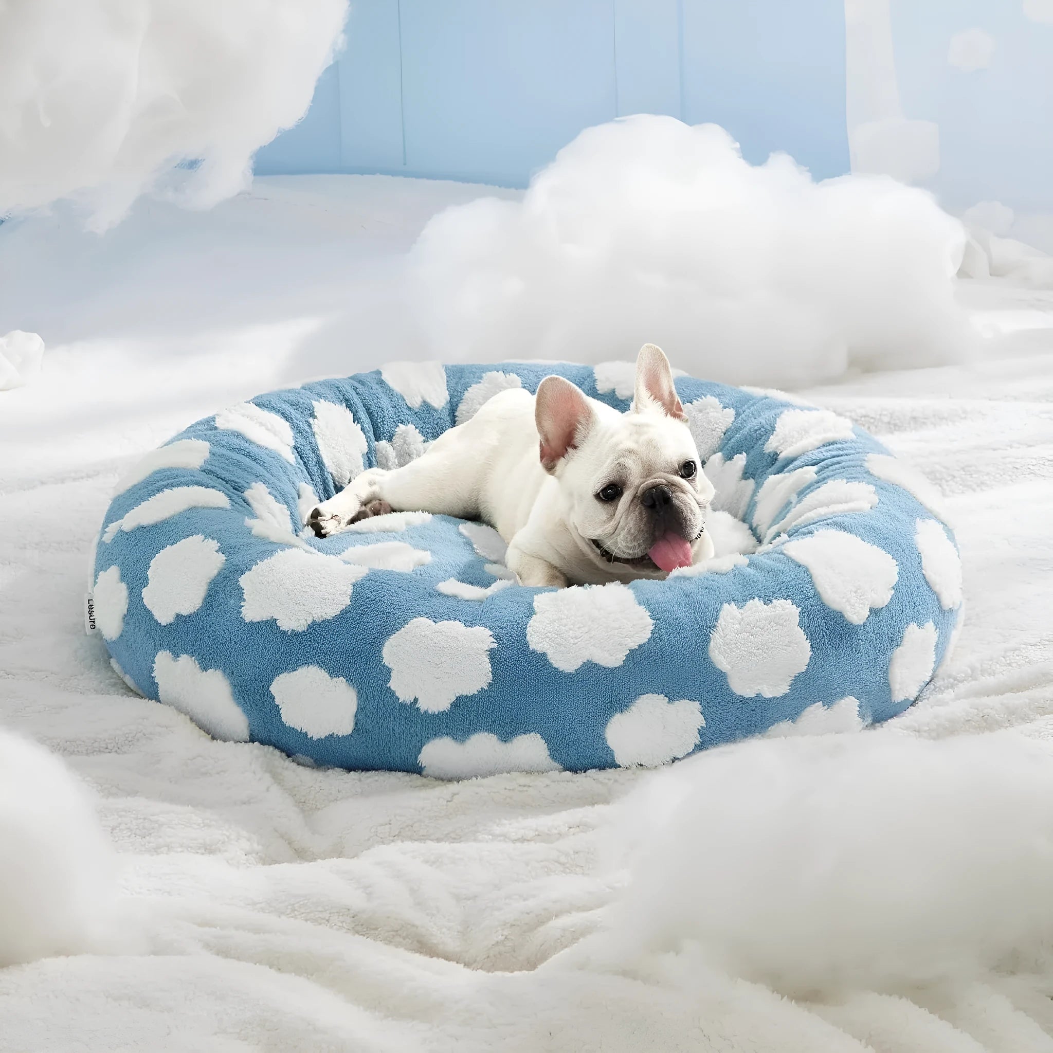 Round plaid dog bed with a plastic base in sea blue and white colour.