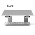 Black aluminium alloy laptop stand on a wooden desk