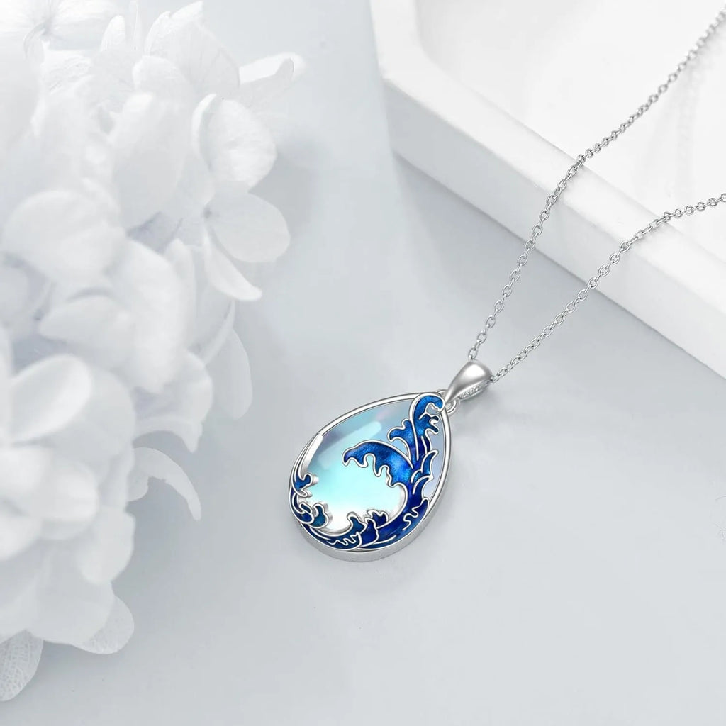 Blue heart-shaped alloy pendant on a necklace chain.